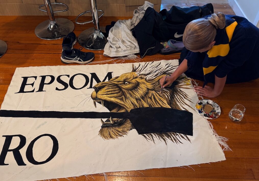 Amanda painting the Lion on the Epsom Maadi Flag