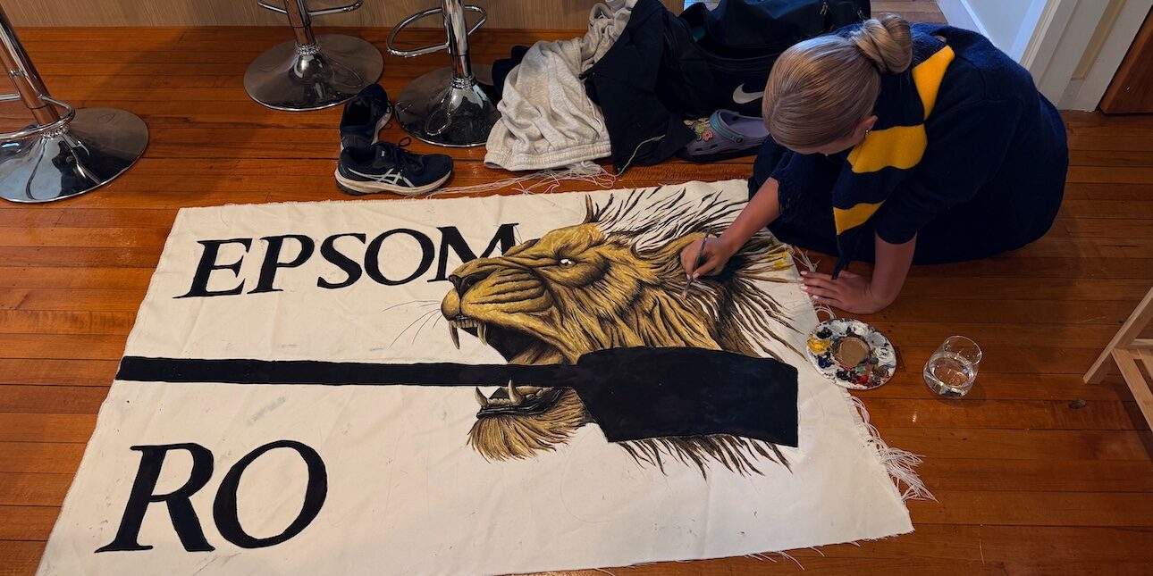 Amanda painting the Lion on the Epsom Maadi Flag